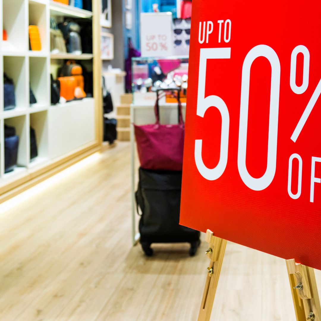 Sale sign in luggage store